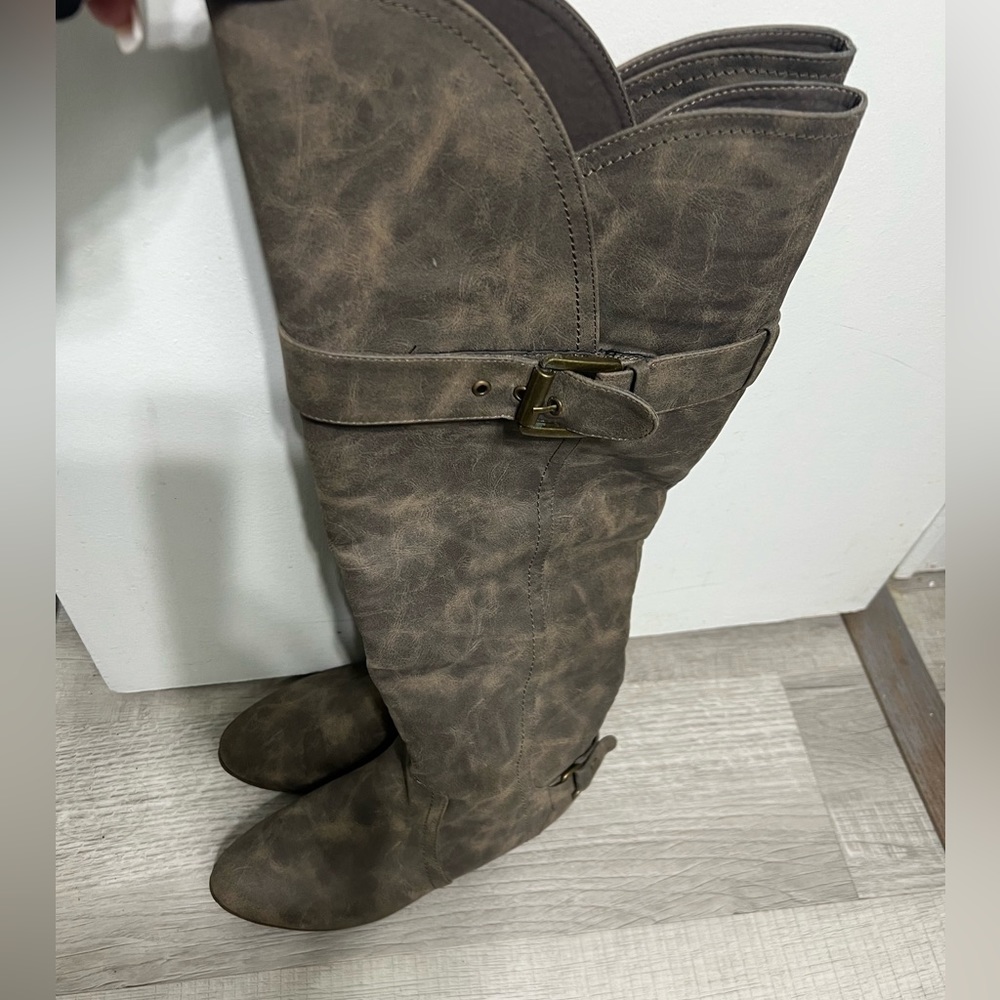 Knee high distressed boots